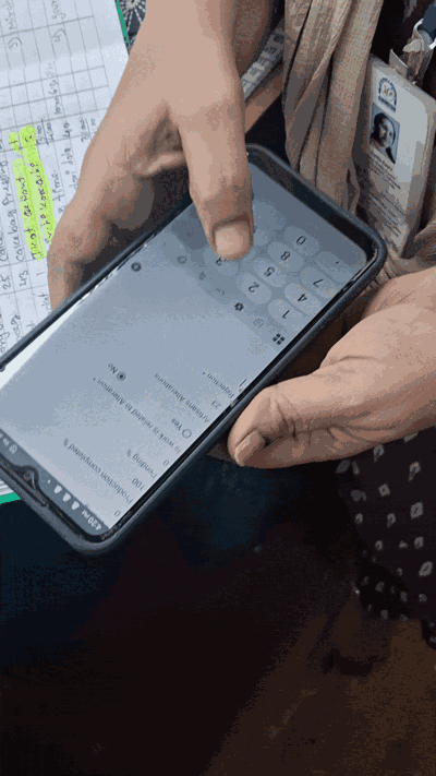 An artisan entering her production details in Avni